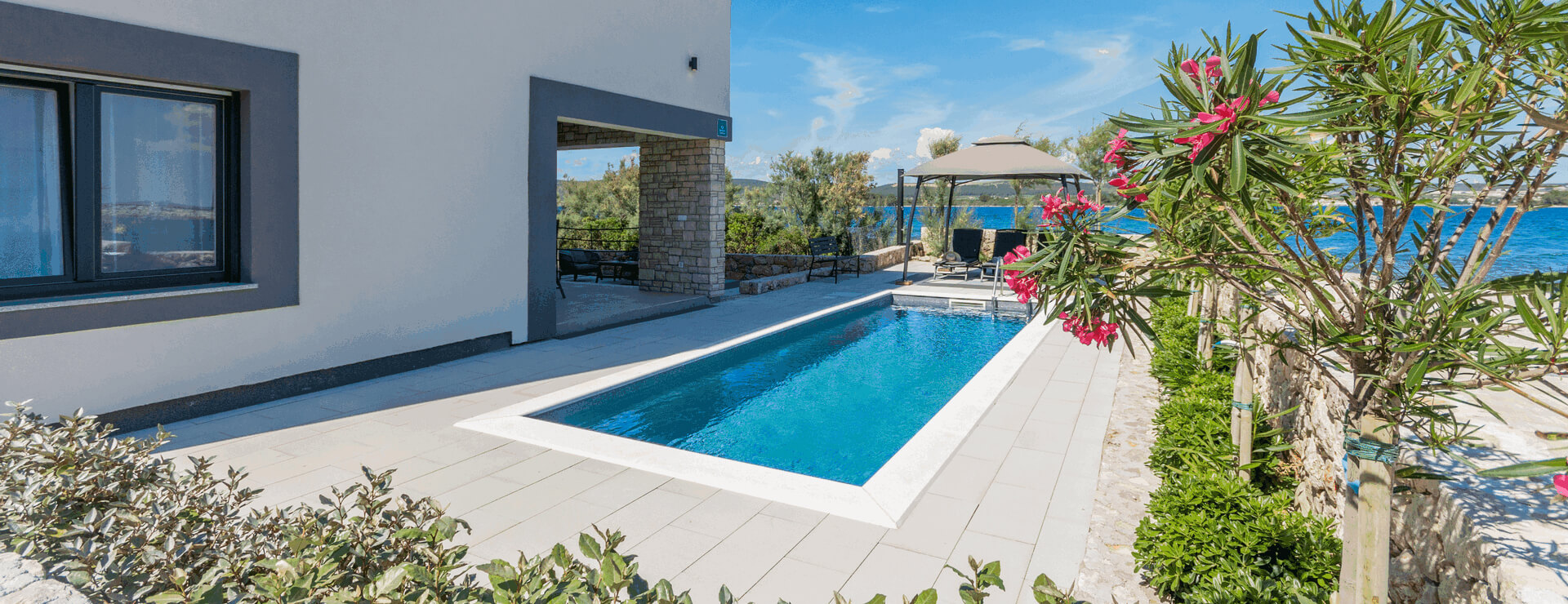 Villa Garden with flowers and swimming pool